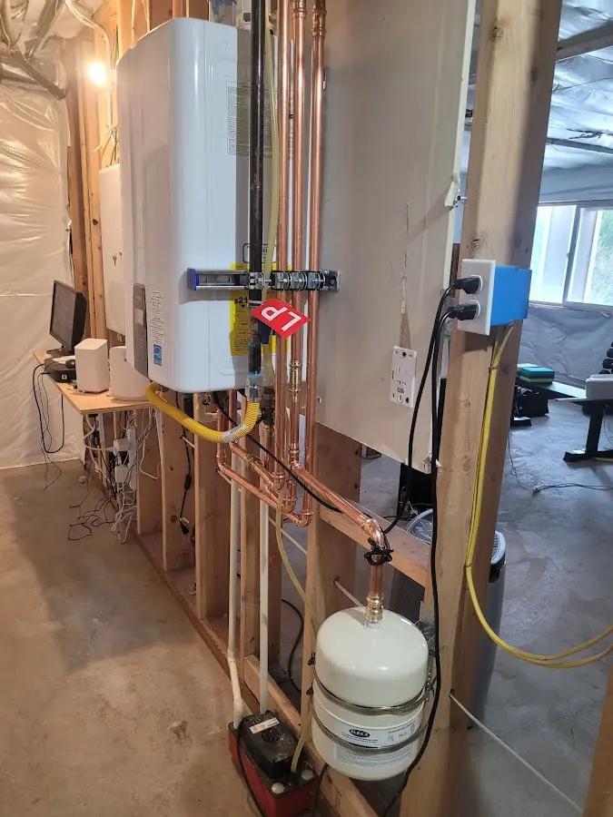 Licensed plumber repairing a kitchen sink in Rollingwood